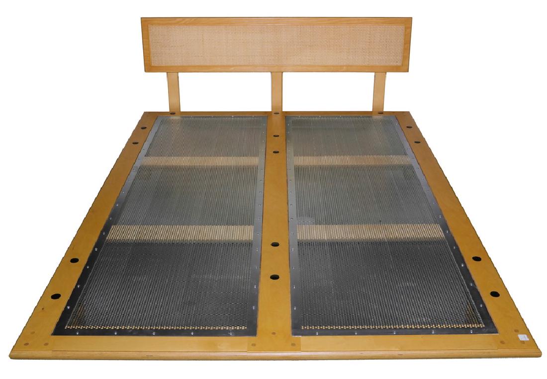 QUEEN SIZE GEORGE NELSON STYLE BED: Birch Ply Bedframe, marked "Modernica, Los Angeles", thin edged, bentwood V-legs, caned plank headboard, perforated steel panels, 10" x 80" x 60", 22 1/2" bolt on headboard. Very good condition. Origi