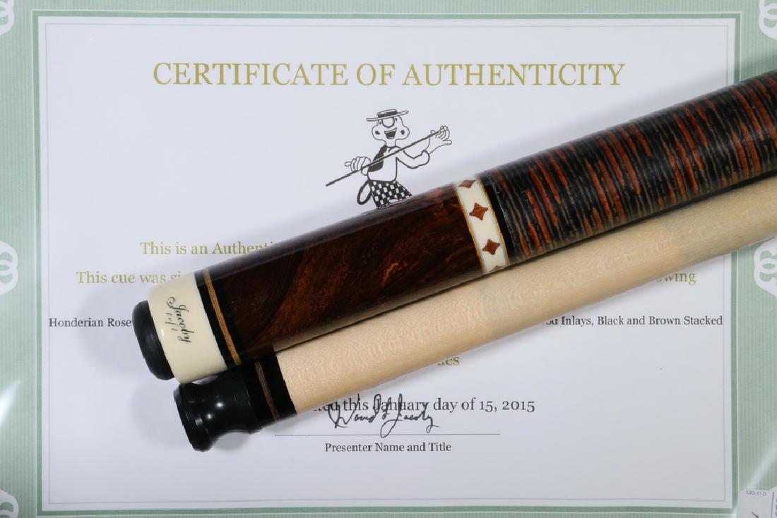 CUSTOM JACOBY POOL CUE: Custom Jacoby Cue, signed and dated 'David L. Jacoby, 1-15', with Honderian rosewood burl forearm and butt sleeve, holly points with veneers, Honderian rosewood inlays, and black and brown stacked lea