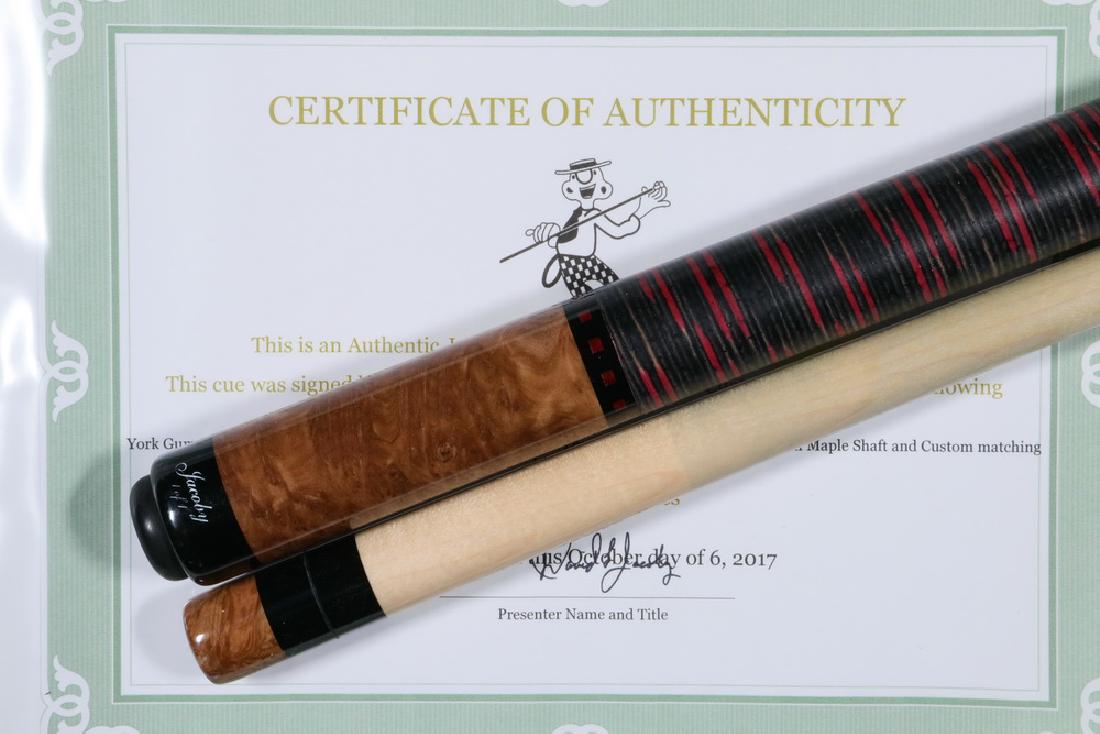 CUSTOM JACOBY POOL CUE: Custom Jacoby Cue, signed and dated 'David L. Jacoby, 10-17', with york gum burl forearm and butt sleeve, black and red stacked leather wrap section with 14mm maple shaft and custom matching joint pro