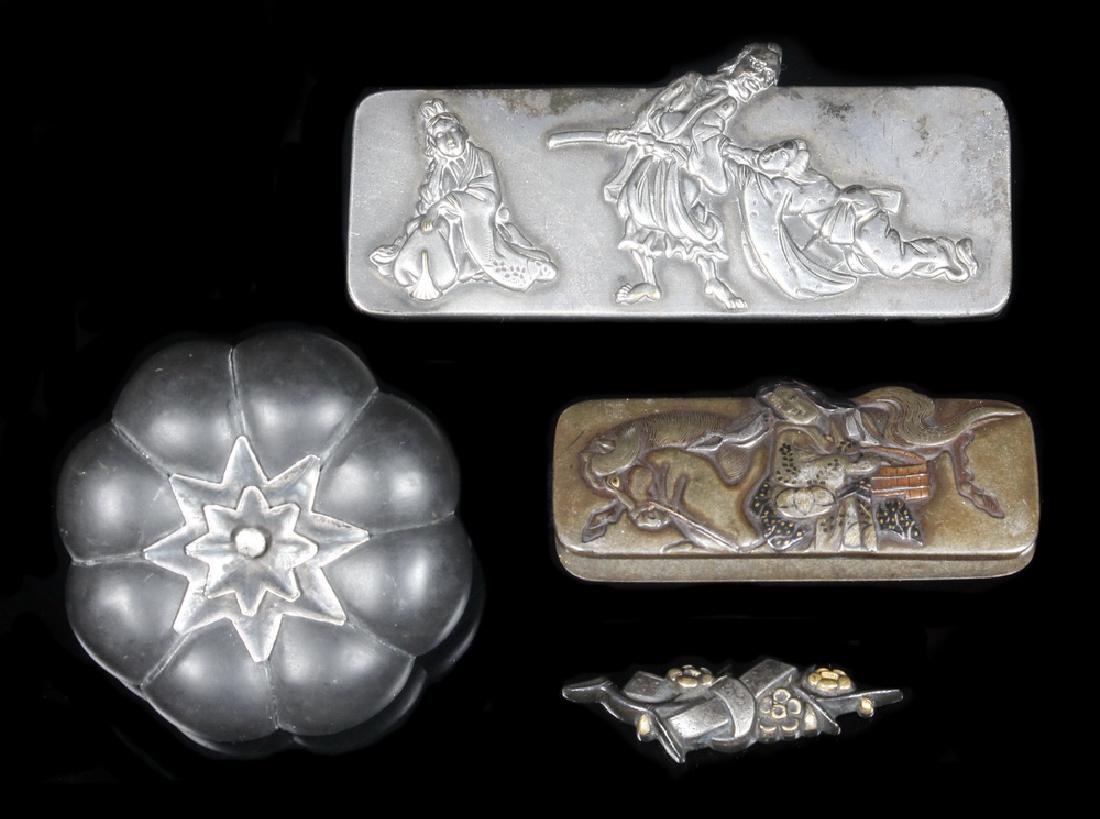 (3) JAPANESE SILVER FITTINGS & IRON MELON FORM TOGGLE: Including: (2) Kanemono Pouch clasps, the first of woman feeding a horse, in silver, copper and gold, with the backplate, 2 1/8" x 7/8"; the second in silver of a Demon claiming a man in front of his 