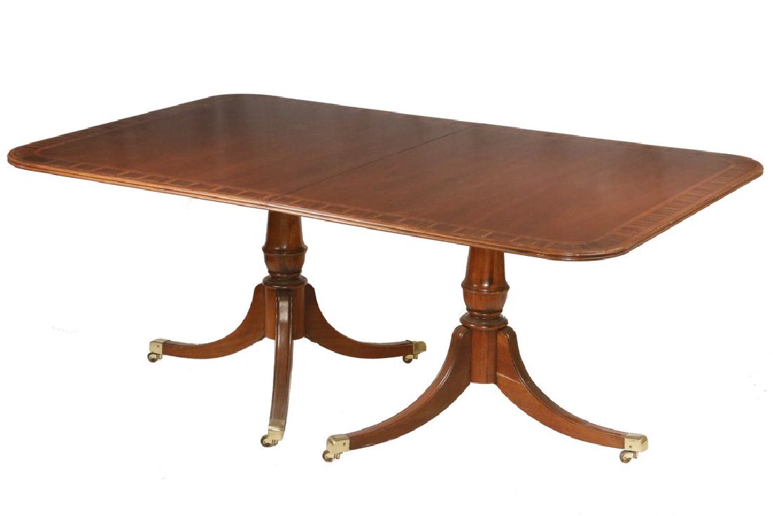 PEDESTAL BASE MAHOGANY DINING TABLE: Finest Quality Two Pedestal Duncan Phyfe Federal Style Dining Table with two leaves, in mahogany with rosewood and mahogany triple cross grain banding, ebony and boxwood stringing, rounded corners wit