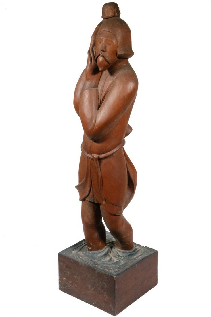 ROBERT LAURENT (ME/NY, 1890-1970): Tibetan Man Carrying Child Across River on his Shoulder, carved mahogany, with integral base, 26 1/2" x 7" x 6 1/2". A few minor scuffs. PROVENANCE: From the estate of Paul Brouillard, Castine, ME.