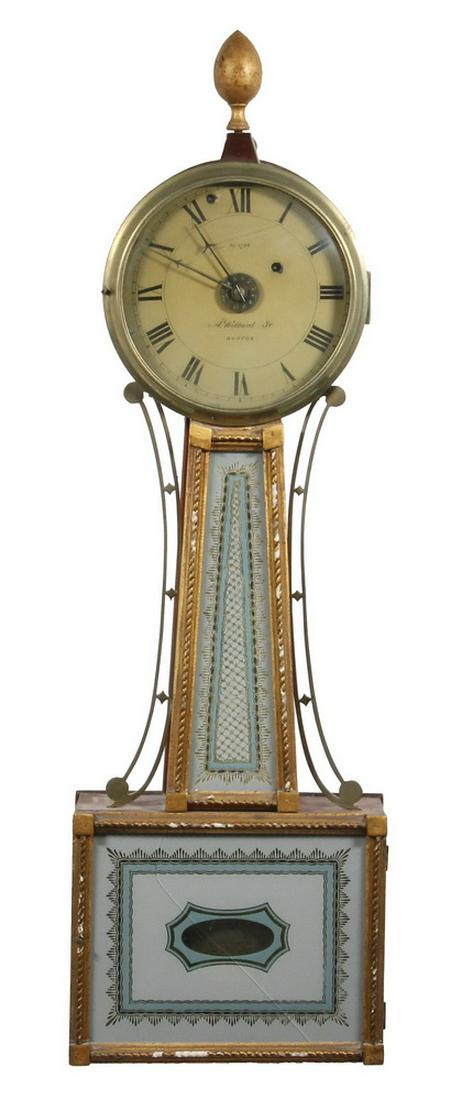 AARON WILLARD BANJO CLOCK, WITH ALARM, CIRCA 1820: Federal Period Mahogany Case with carved gold rope and block trim, brass bezel, convex glass over painted iron dial signed "A. Willard, Jr., Boston, No. 1728", brass alarm ring behind hands; having pa