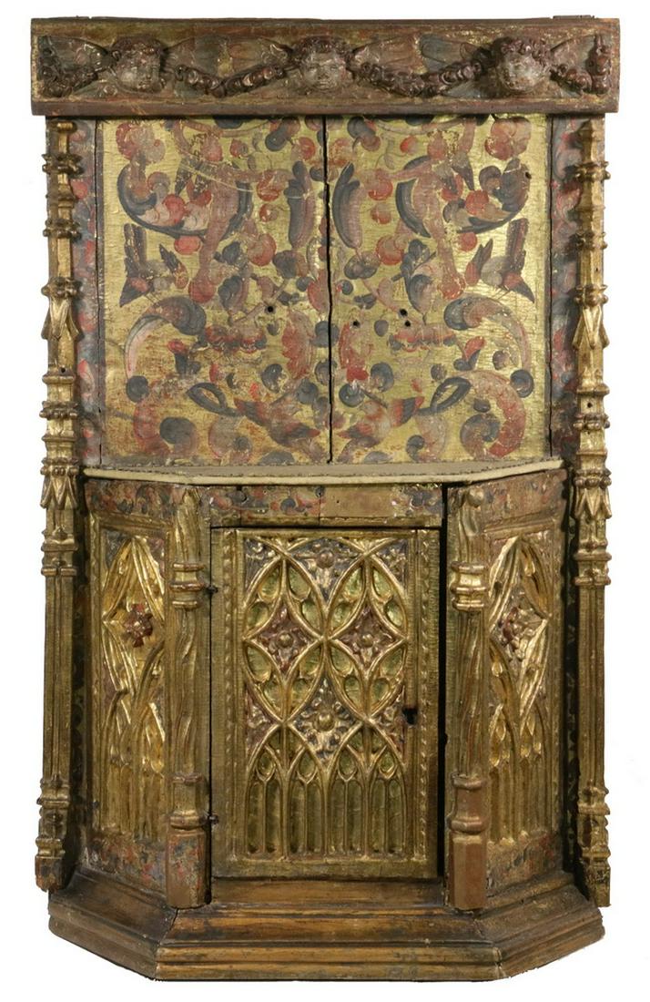 RARE CONTINENTAL GOTHIC SACRISTY CABINET: Well preserved polychromed and gilt Gothic Ciborium, a sacristy cabinet, probably French, 14th c., with a putti carved frieze, upper central panel having painted song birds, flowers and amorini, flank