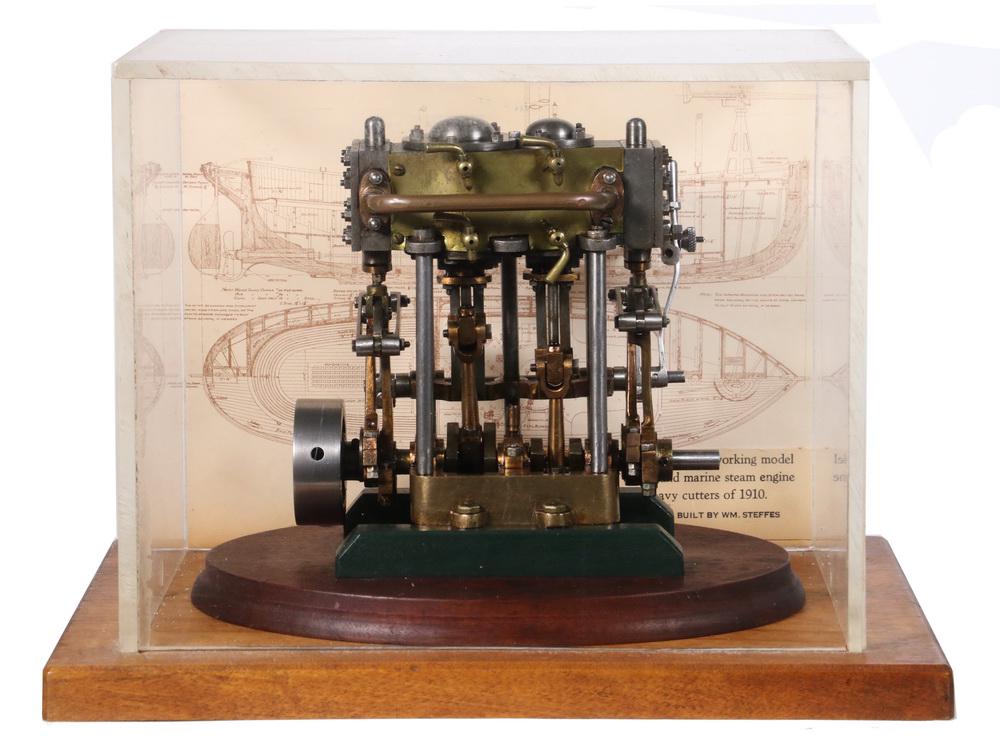 LARGE WORKING MODEL ENGINE: Handmade Scale Working Model of a Compound Marine Steam Engine used in Navy Cutters, circa 1910. In a plastic and oak display case with a blueprint backing of a 28 foot US Navy Steam Cutter of 1910. C
