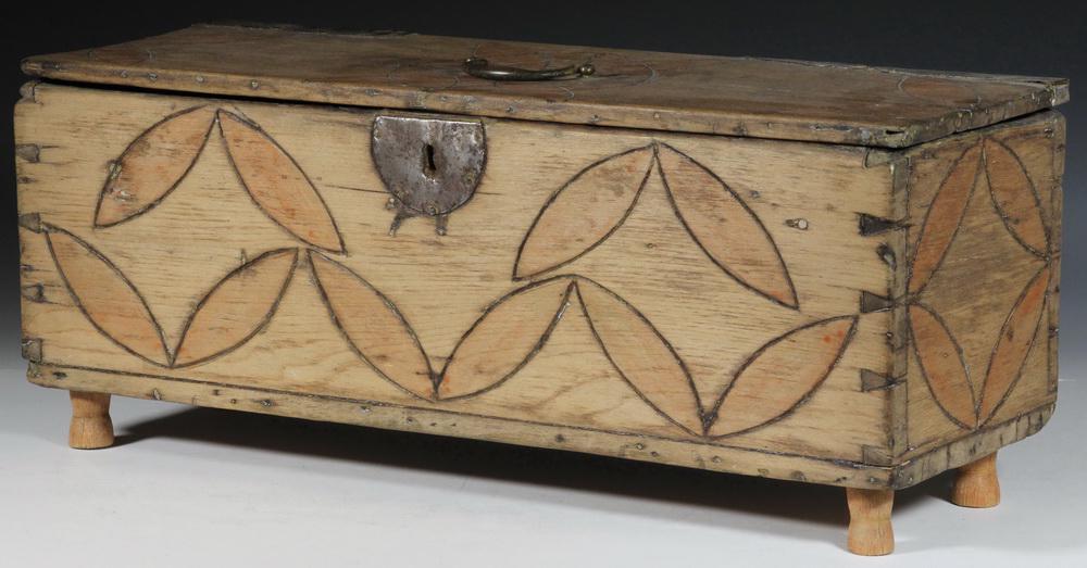 FOLK ART WOODEN STORAGE BOX: 19th c. Dovetailed Wooden Miniature Storage Chest, with interior ditty box, iron hardware, later carved and painted decoration and wooden feet, 8" high, 19 3/4" x 7". Lock hardware missing from lid, s