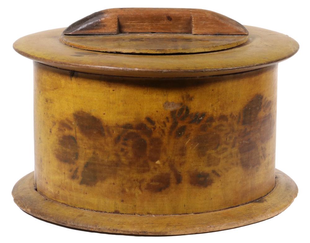 ROUND STENCILED STORAGE BOX: 19th c. Round Wooden Lidded Storage Box, with stenciled floral decoration on ochre paint, twist lid opening, 6 1/2" high, 9 3/4" diam. Surface wear, edge chips, small hole center bottom, shrinkage cra