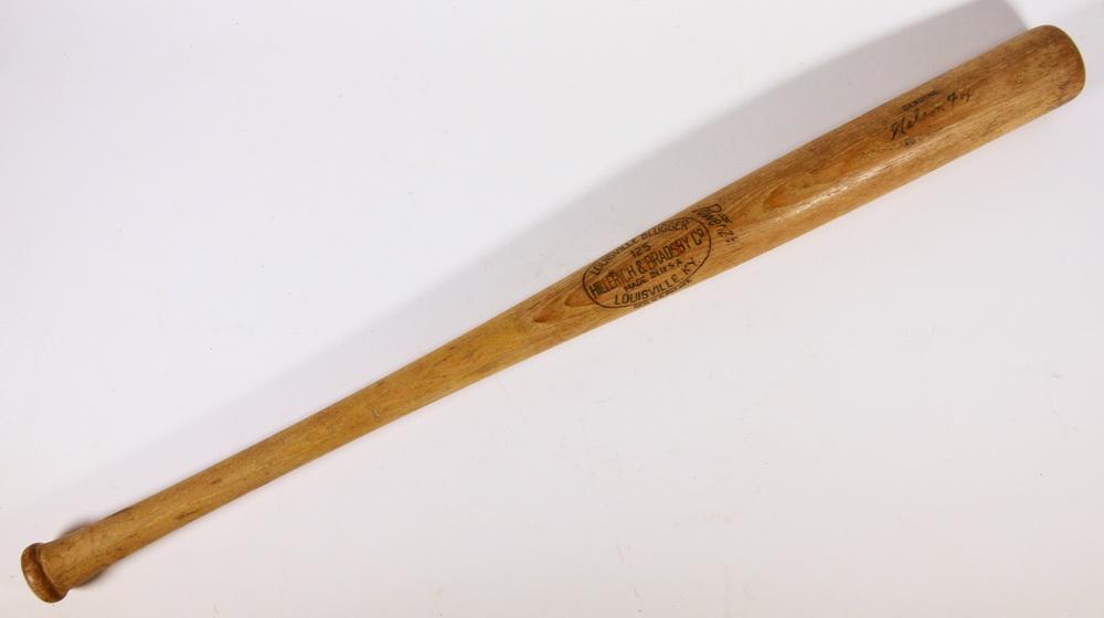 VINTAGE LOUISVILLE SLUGGER NELSON FOX BASEBALL BAT: Vintage Powerized Hillerich & Bradsby Louisville Slugger 125 Genuine Nelson Fox Baseball Bat, marked '34' on end of handle, 1960s era, 33 3/4" long, 2 3/4" diam. at thick end. Surface wear, one tiny s