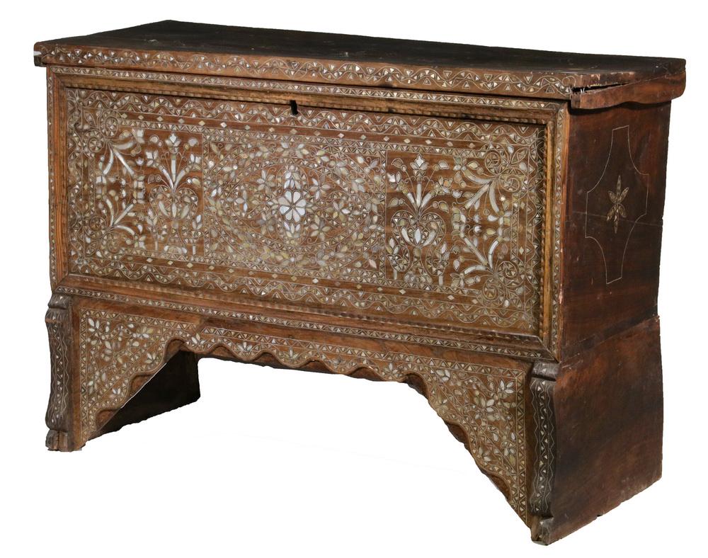 SYRIAN INLAID WOODEN CHEST: Hardwood Chest with typical bone and white metal inlay, having a central floral cartouche on the heavy slab lid, the front and sides with overall vine and blossom decoration, slab ends, shaped skirt a