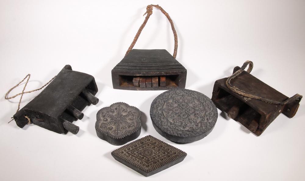 (3) COWBELLS & (3) PRINTING BLOCKS: Lot of (6) Asian Carved Wooden Objects, 20th c, including: (3) Textile printing blocks from Indonesia, 4 1/2" to 7 1/4" wide; (2) Wooden cowbells from Bhutan, with straps, 6" x 9 1/2" and 6 1/2" x 9"