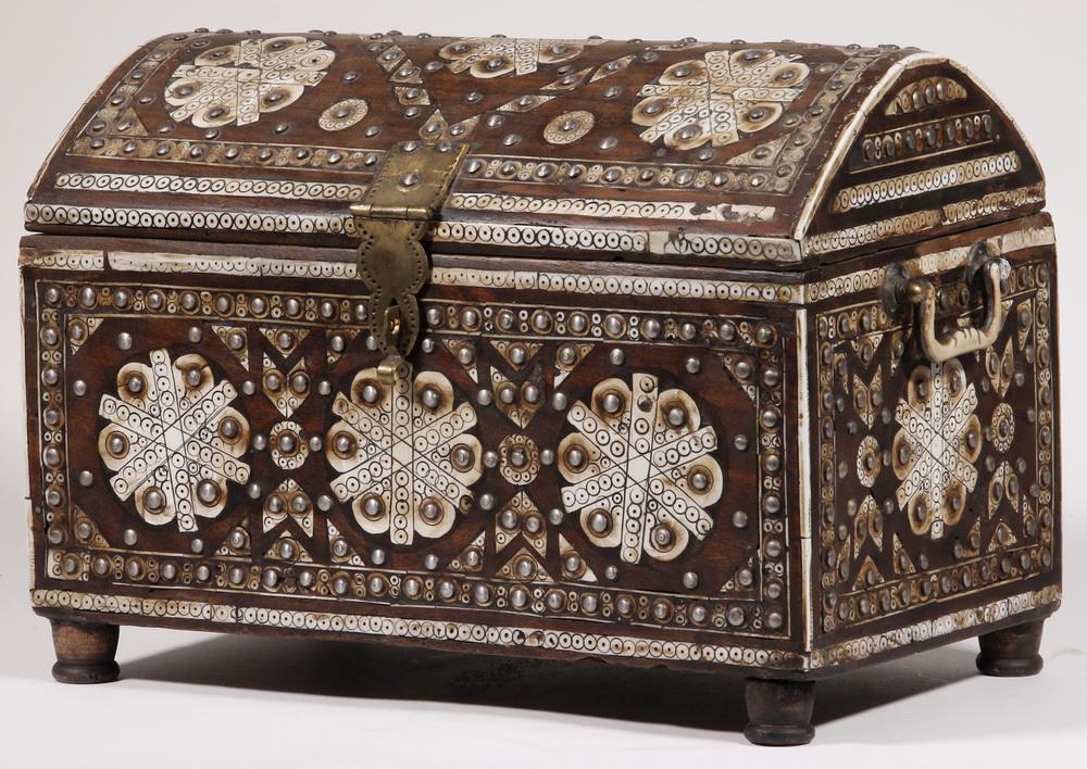 MIDDLE EASTERN CHEST: Dome Top Chest with Decorative Bone Inlay, 20th c., with nail head decoration and brass hinges and clasp, bone and brass side handles, lid interior with painted decoration, set on four wooden cylindri