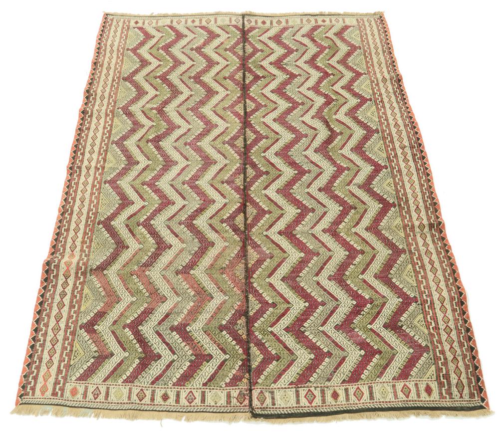 BROADCLOTH - 6'-7" x 4'-8": Two piece seamed Broadcloth with zigzag pattern. Red, green and ivory with intricate border. Good condition.
