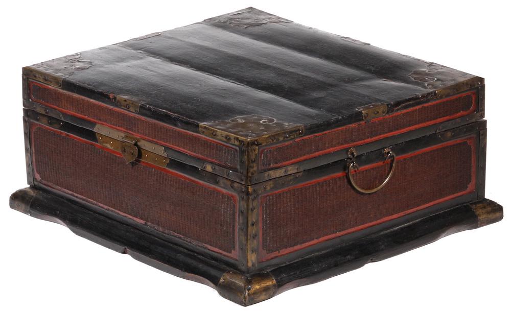 CHINESE WOOD, BAMBOO AND BRASS TRAVEL CHEST: 19th c. Valuables Chest in black lacquered wood with hinged top, decorative brass corners and bindings, bamboo caned panels in natural finish with red borders, brass hasp, bail lifts on sides, black l