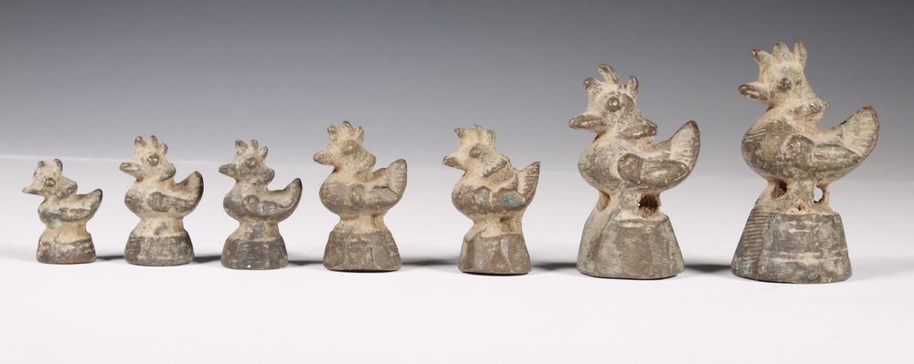 (7) SYRIAN BRONZE GOLD WEIGHTS: Scale Weights for Weighing Gold, in the form of roosters, 19th-20th c. Roughly 1" to 2 1/4" tall. Encrusted.
