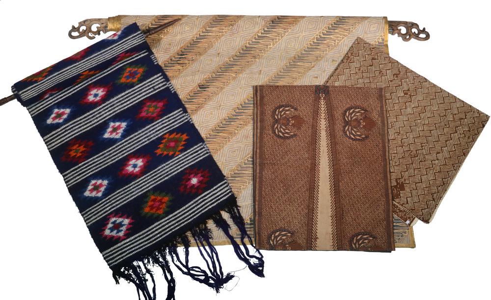 (4) INDONESIAN TEXTILES, TWO WITH HANGERS: Group of (4) Indonesian Textiles, including: Large batik hanging panel with gilt overpainting, with carved wooden hanger, panel: 43 3/4" x 82", hanger: 58" wide, 1 1/2" wide hole in panel; Woven dark 