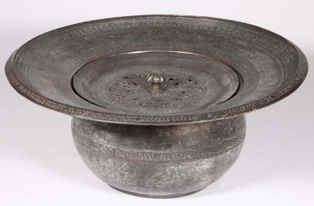 SYRIAN CHARCOAL BRAZIER: Syrian Tinned Copper Charcoal Brazier, with reticulated lid and chased decoration, 5 5/8" high, 12 5/8" diam. Surface wear, tinning losses.