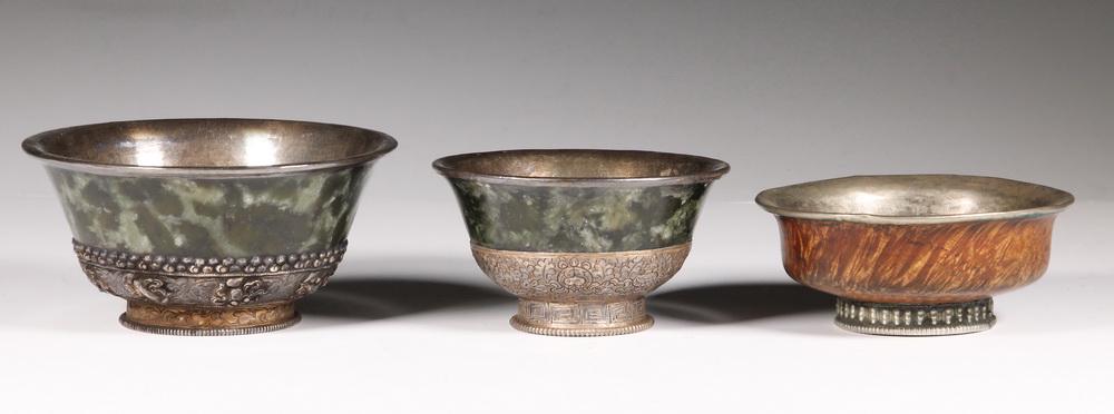 (3) BURMESE BOWLS: Group of (3) White Metal Mounted Bowls from Myanmar/Burma, including: (2) Carved green alabaster with fancy repousse decorated metals mounts, 2" high, 4" diam. and 2 1/2" high, 5" diam.; and Metal mou
