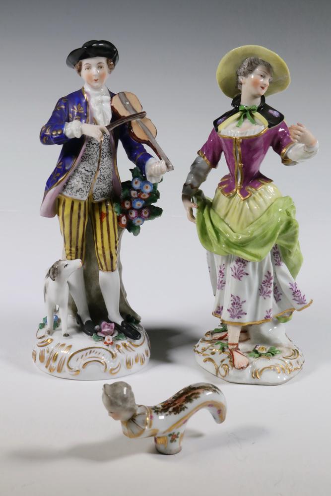 (2) PORCELAIN FIGURINES & (1) FIGURAL PARASOL HANDLE: Lot of (3) Pieces of Late 19th - Early 20th c. Porcelain, likely by Edme Samson, Paris, including: Figurine depicting a man with violin and dog, gold anchor mark to back of base, 7 1/2" high, 2 1/2" d