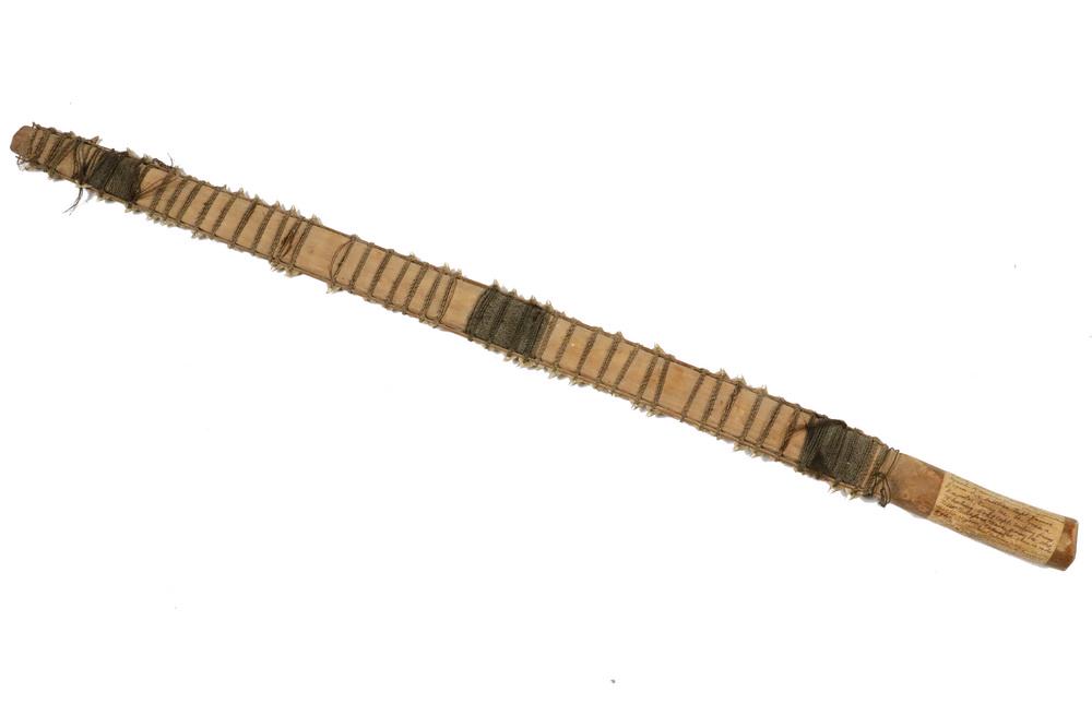 PRE-1850 GILBERT ISLANDS "SPINE TURNER": Micronesian Palmwood Sword, set with drilled Kiribati sharks' teeth, bound with tekro coconut fiber and with decoration of human hair, and having a very old handwritten label adhered to the handle tha