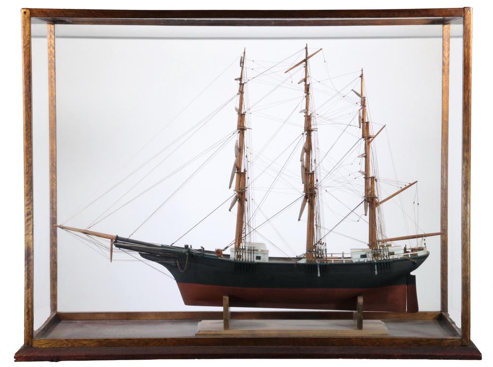 LARGE SHIP MODEL IN CASE: Clipper Ship "Red Jacket", fully rigged but without sail, in oak and glass case, unmarked, circa 1900, roughly 30" x 40" x 17" overall. Very good condition, decay to some lead blocks has loosened some
