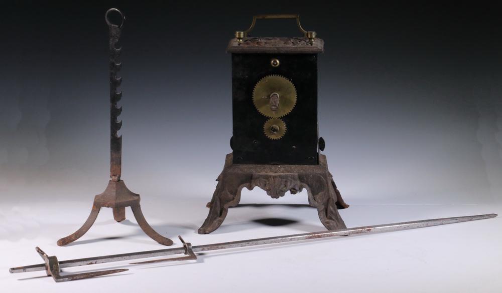 19TH C. CLOCKWORK JACK SPIT: Scarce French Cast and Sheet Iron Hearth Clockwork Rotisserie having steel works and bell, crank winder, brass handle and external gears, original nickel plated spit and iron receiver stand, 12" x 9" 