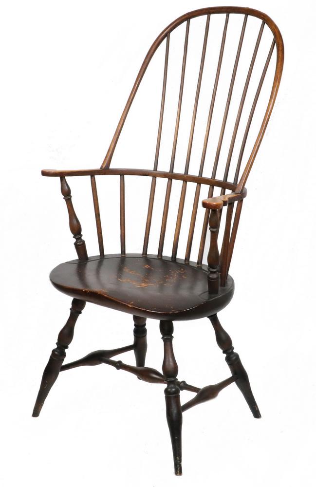18TH C. SACK BACK WINDSOR CHAIR: Fine Tall and Shallow Sack Back Windsor Chair of bent oak, ash spindles and well-formed pine seat, in remnants of the original black casein paint, 17 1/2" seat, 29" arms, 46 3/4" back, 26 1/2" x 23".