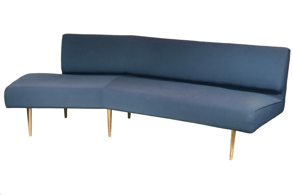 EDWARD WORMLEY MIDCENTURY SOFA: Mid-20th c. Angled "Boomerang" Sofa by Dunbar, designed by Edward Wormley, blue woven fabric upholstery trimmed with self piping, polished bronze metal legs, 29 1/2" high, 83" x 29 1/2", 17" high seat