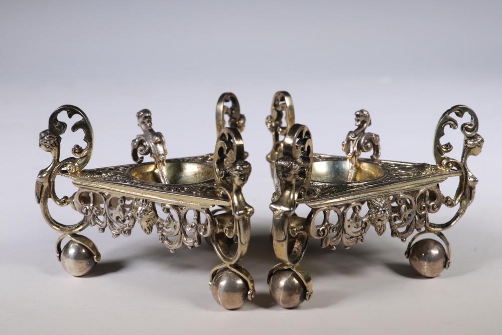 PR GERMAN SILVER MASTER SALTS: Pair of Mid-19th c. Heavy Gilt Silver Triangular Figural Master Salts by J.D. Schleissner & Sohne, Hanau, with matching figural salt spoons with griffin heads, top surface and side handles with human 