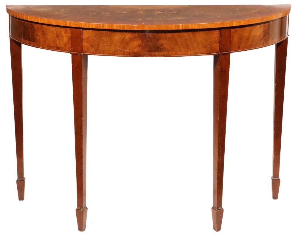 DEMILUNE CONSOLE TABLE: Hepplewhite Style Inlaid Mahogany Demilune Pier Table, 20th c., top with fan inlay and crossbanded edge, tapered legs and spade feet, 32" high, 43 3/4" x 19". Losses to top surface.