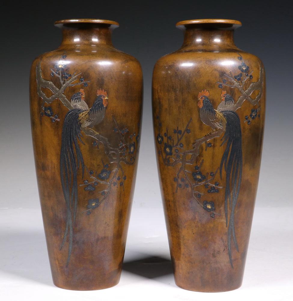 A FINE PR OF LATE MEIJI JAPANESE MIXED METAL VASES: Bronze High-Shouldered Stem Vases with gold, silver and copper inlaid opposing figures of Onagadori Long-Tailed Roosters perched on flowering branches, circa 1900, unsigned, 8 1/4" tall, 3 1/2" diam. 