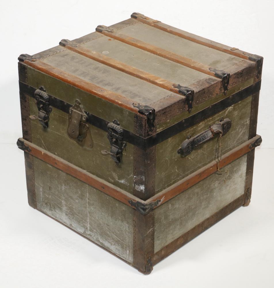 COACHING TRUNK WITH "INDIAN ARTIFACTS" STENCIL, (40): Green cloth, oak and metal trunk with 1893 patent, latches, 20" cube. Good condition. This housed Ouina's collection of Native American stone artifacts.