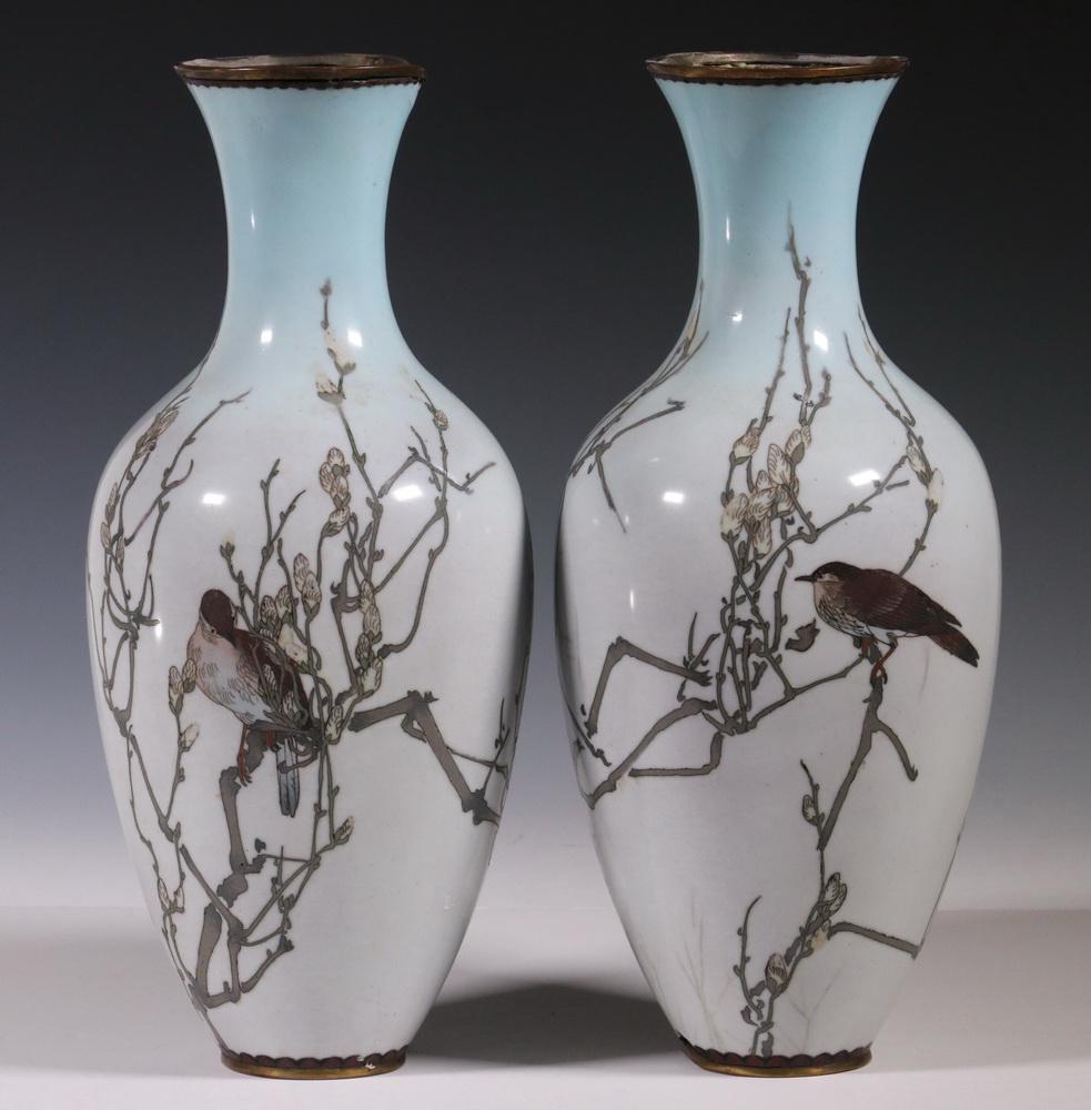 RARE PAIR OF OPEN FIELD JAPANESE CLOISONNE VASES: Meiji Period Ovoid Vases with long tapered necks, enamel over bronze, featuring opposing figures of sparrows in budding cherry tree branches, the field in pale sky blue, ombred to darker top, pale gre