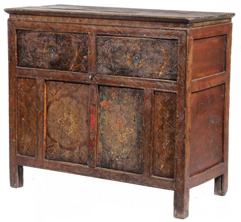 ANTIQUE LACQUERED TIBETAN CABINET: 19th c. Robe Cabinet with molded edge black top set by mortise and tenon, red lacquered panel and beaded edge case having two drawers over two doors, decorated with intricate scraffito polychrome, bra