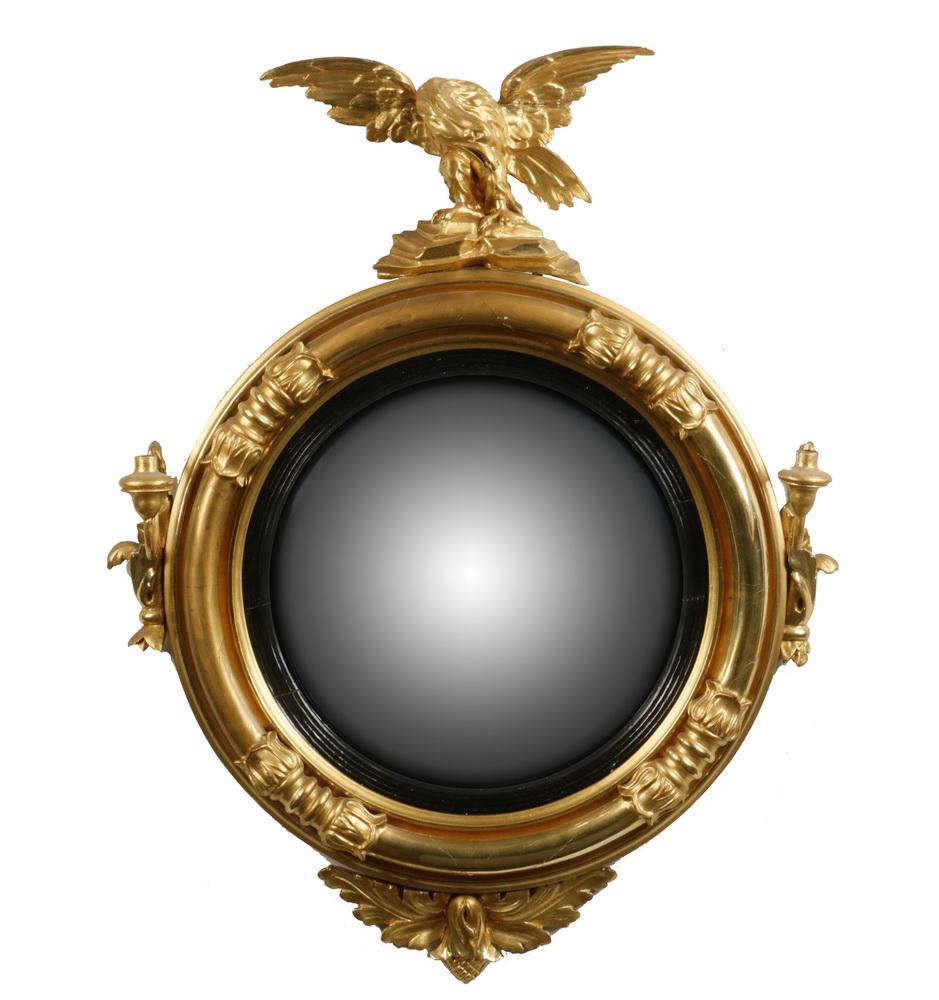 EARLY AMERICAN BULL'S-EYE 'CONSTITUTION' MIRROR: Early 19th c. Desirable Scale Convex Mirror in an ornate boldly carved round columnar acanthus leaf segmented water gilt frame, with single socket side candle sconces, full body spread wing eagle abov