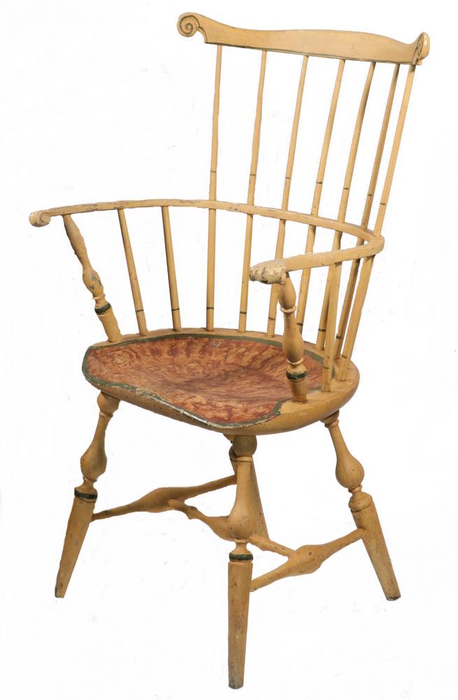 PAINTED FAN-BACK WINDSOR ARMCHAIR: 19th c. Fan-Back Windsor Armchair, with pale melon and green painted surface, rag rolled seat, with carved ears and shaped crest rail, knuckle arms, wide shaped saddle seat, seven spindles, bulbous tu