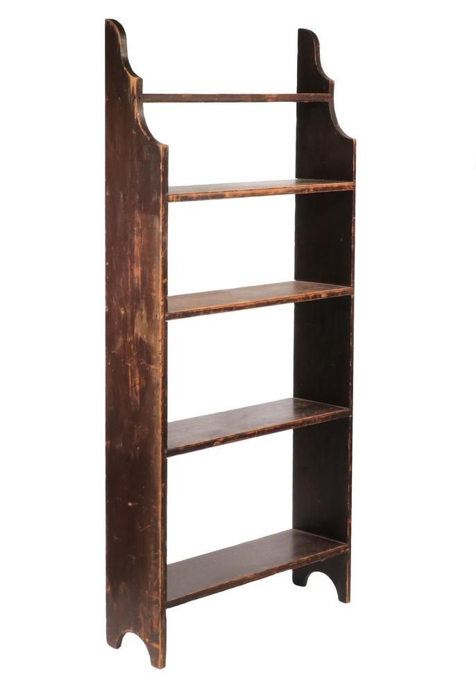 NEW ENGLAND OPEN PINE BOOK SHELF IN BROWN PAINT: Five Shelf, with the uppermost stepped back, shaped top and bracket feet, beaded front edge, 61" x 27" x 8 1/2". Nice age and use patina.