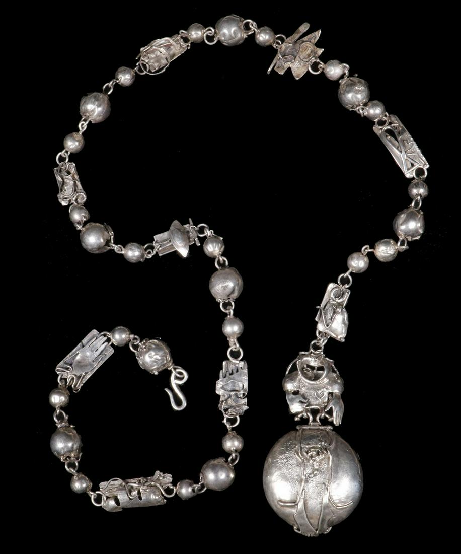VINCENT FERRINI STERLING BELT - NECKLACE: Modern Design Silver Link Chain by Jewelry Artisan Vincent Ferrini (MA, 1933- ), combining naturalistic design hollow beads and a variety of abstract and figural links, ending with a round locket form