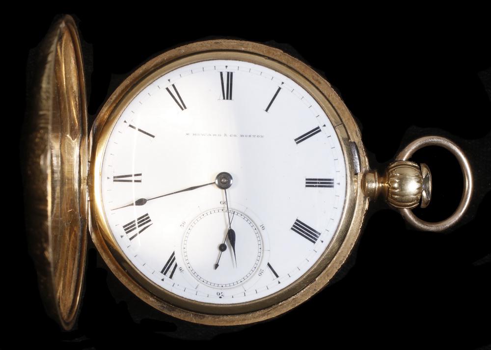 E. HOWARD POCKET WATCH: E. Howard Pocket Watch, 18S in 18K yellow gold hunter case with white face and Roman numerals. Movement #22623N, case #3038. Engraved shell pattern case 'M.S'. Gold loss on push button and moderate we