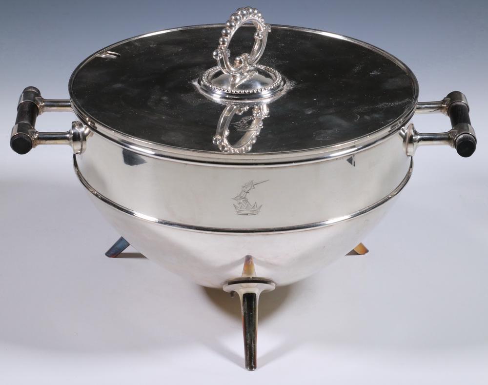 CHRISTOPHER DRESSER DESIGNED SILVER-PLATED TUREEN: Circa 1880 English Electro-Plated Lidded Tureen by Hukin & Heath, Birmingham, designed by Christopher Dresser, with ebony handles and set on three spike form legs, base and lid engraved with crest dep