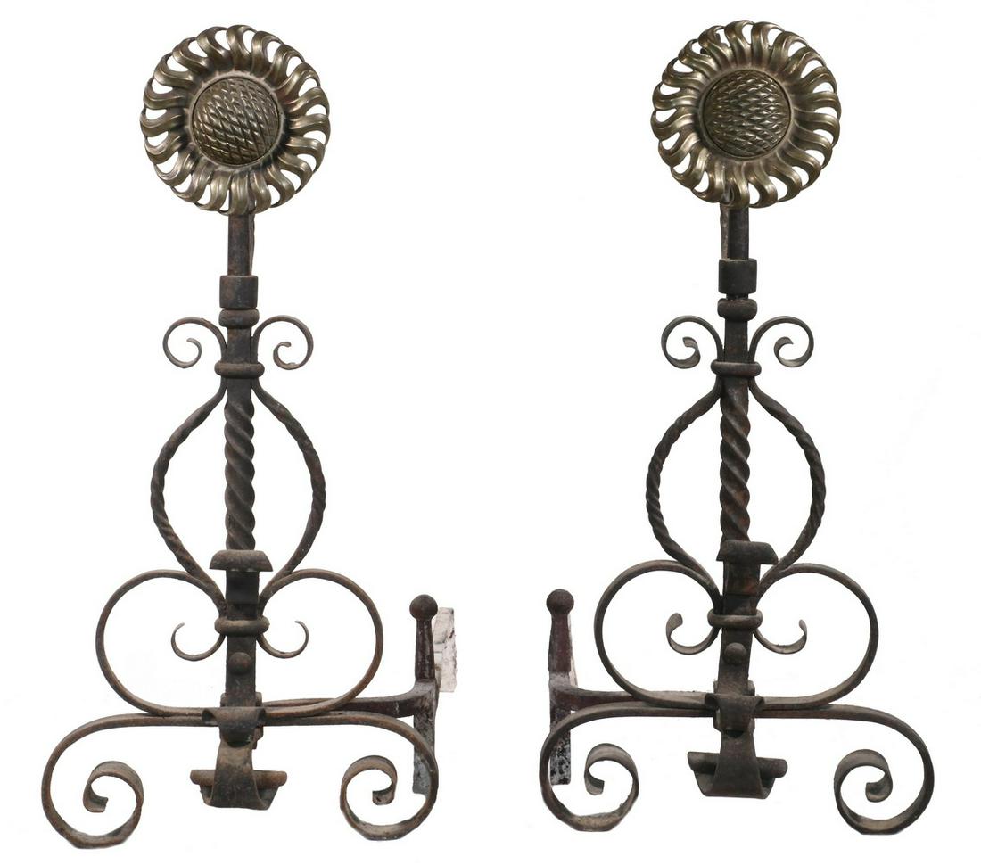 PR IRON AND BRASS SUNFLOWER ANDIRONS: Pair of Late 19th c. Fancy Wrought Iron and Brass Sunflower Form Andirons, probably English Aesthetic Movement, each with swing out kettle hanger, 25 1/2" high, 12 1/2" x 21". Surface wear.