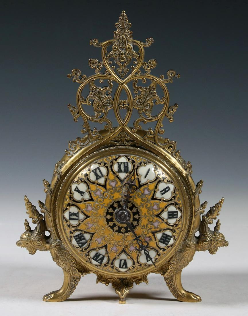 FERDINAND BARBEDIENNE (1810-1892) ENAMELED AND GILT: French Boudoir Clock with domed enameled dial, reticulated vine handle on top, resting on gryphon form feet with a decorated barrel on back, marked behind the bell by "Le Fevre & Fils, Paris, 4663, C1