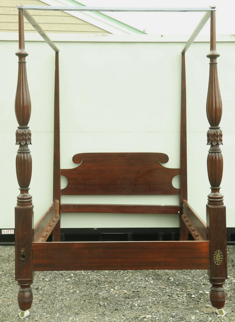 19TH C. CHIPPENDALE HIGH POST CANOPY BED: Belle Epoch Mahogany Bed with posts carved in bowed reeds, turned rings and acanthus leaf crowns, 64" x 56 1/2" x 83 1/2", takes a 47" x 75" double box. Missing bed bolts, brass bolt covers and one ca