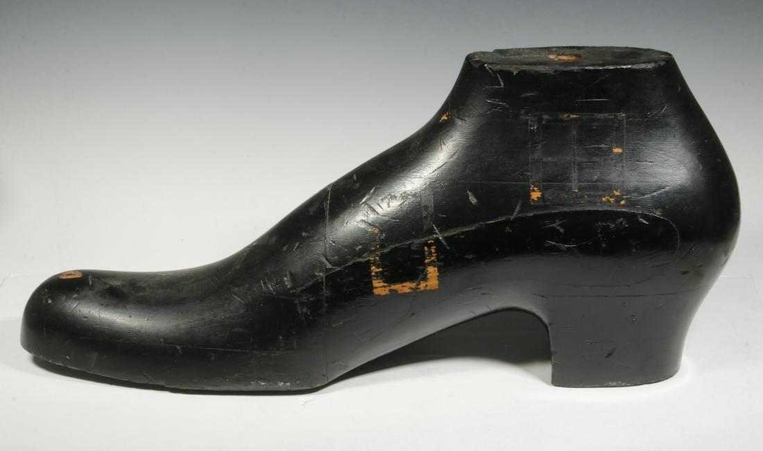 SHOE FORM TRADE SIGN: Painted and Carved Wooden Shoe Form Trade Sign, 12" high, 26" x 8". Scuffs to paint. Provenance: From the Estate of Rosemarie Wolfe, Cape Elizabeth, ME