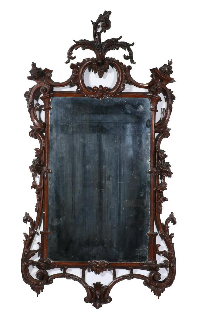 MAGNIFICENT 18TH C. PERIOD CHIPPENDALE MIRROR: English Chippendale Looking Glass, circa 1760, early style with heavy Baroque influence, beautifully carved with delicate reticulation, in a warm brown finish over gesso, retaining the original thin s