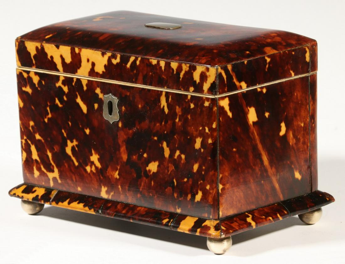 TORTOISESHELL TEA CADDY: English 19th c. Tortoiseshell Tea Caddy, with unengraved silver lid cartouche and escutcheon (no key), velvet lined lid, interior with two compartments with wooden lids, molded skirt and four metal ba