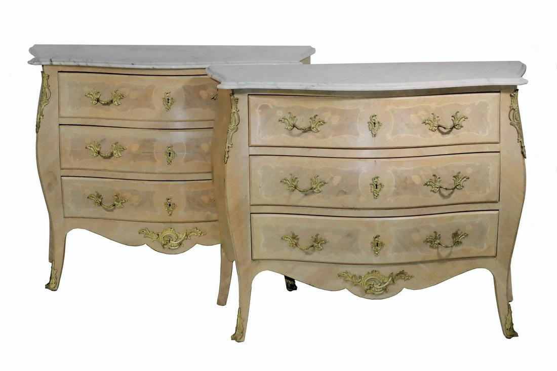 PR FRENCH COMMODES: Pair of Custom French Inlaid Marble Top Commodes, 20th c., bombe form with bleached finish and decorative brass mounts, parquetry and floral inlaid sides and drawer fronts, each with three dovetailed
