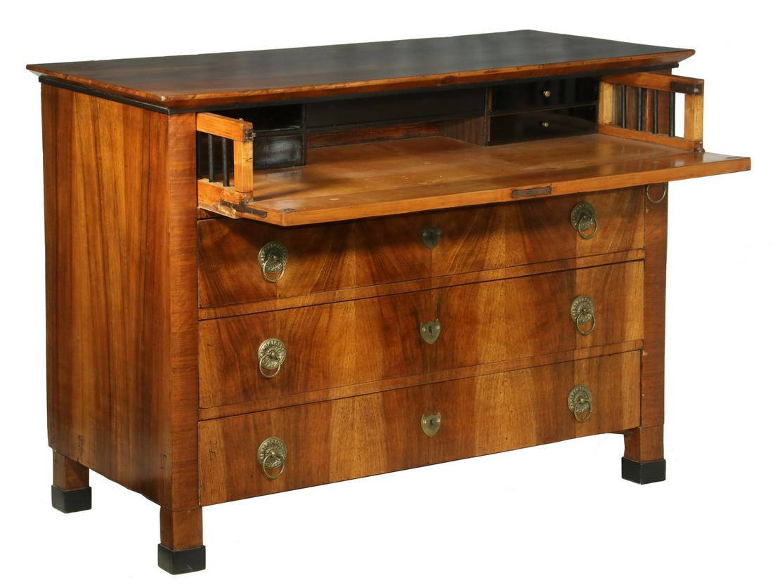 BIEDERMEIER BUTLER CHEST: Early 19th c. Biedermeier Walnut Butler's Chest, with polished molded edge overhanging top, drawer fronts with book matched veneers, original brass drop ring pulls and shield form lock escutcheons (wi