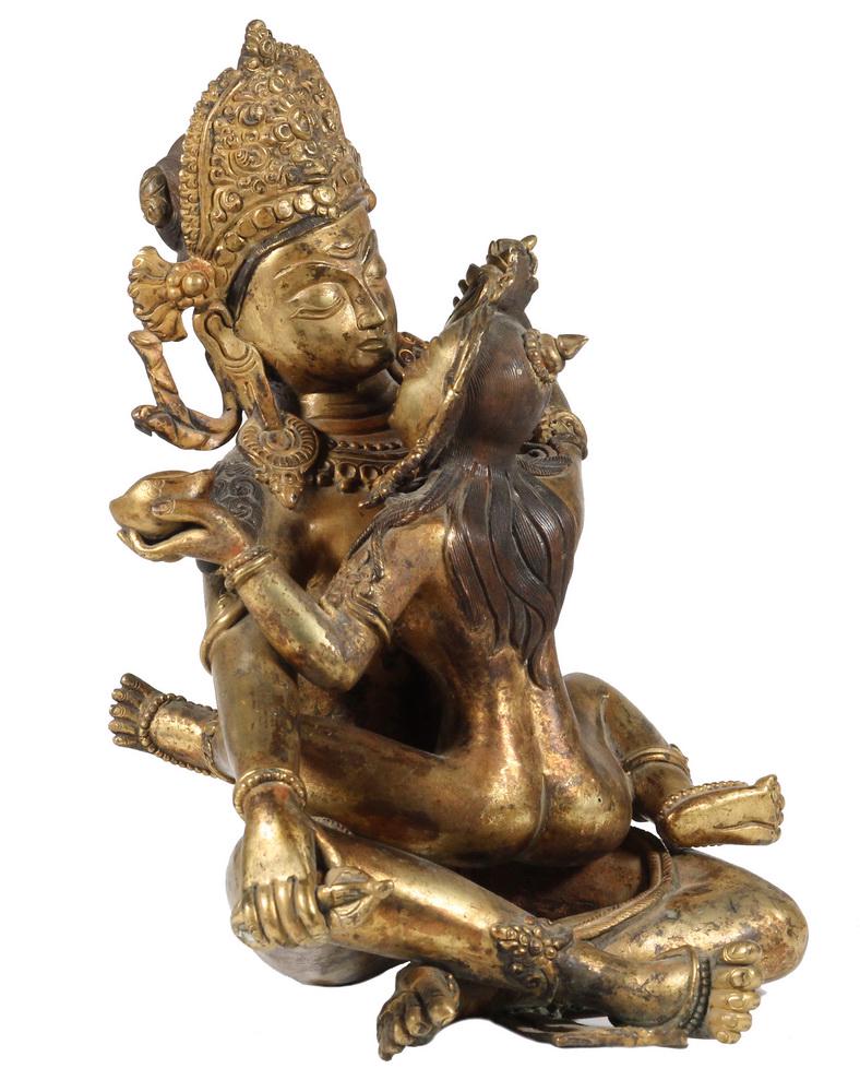 (2 PC) 18TH C. SHIVA WITH PARVATI BRONZE: Extremely fine detailed 18th c. Gilt Bronze Nepalese Figure of Shiva with Parvati seated in his lap facing him, making offerings. The two figures were cast separately and interlocked. Her chest has be