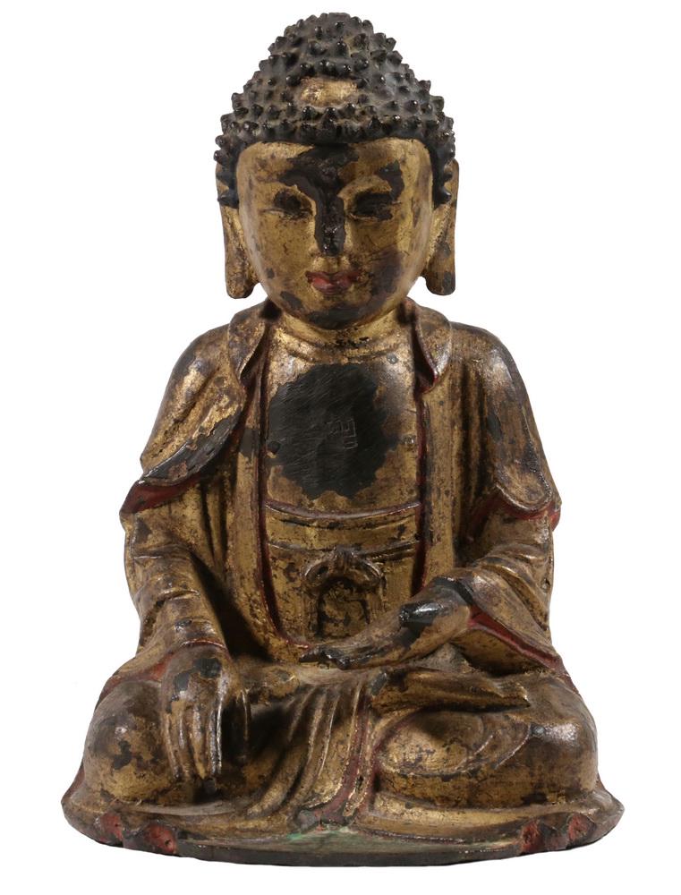 EARLY CHINESE BRONZE: A cast gilt bronze figure of the Buddha of Medicine, with engraved symbols on the chest, Ming Dynasty, 8" tall.