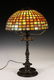 BRONZE TABLE LAMP WITH LEADED GLASS SHADE